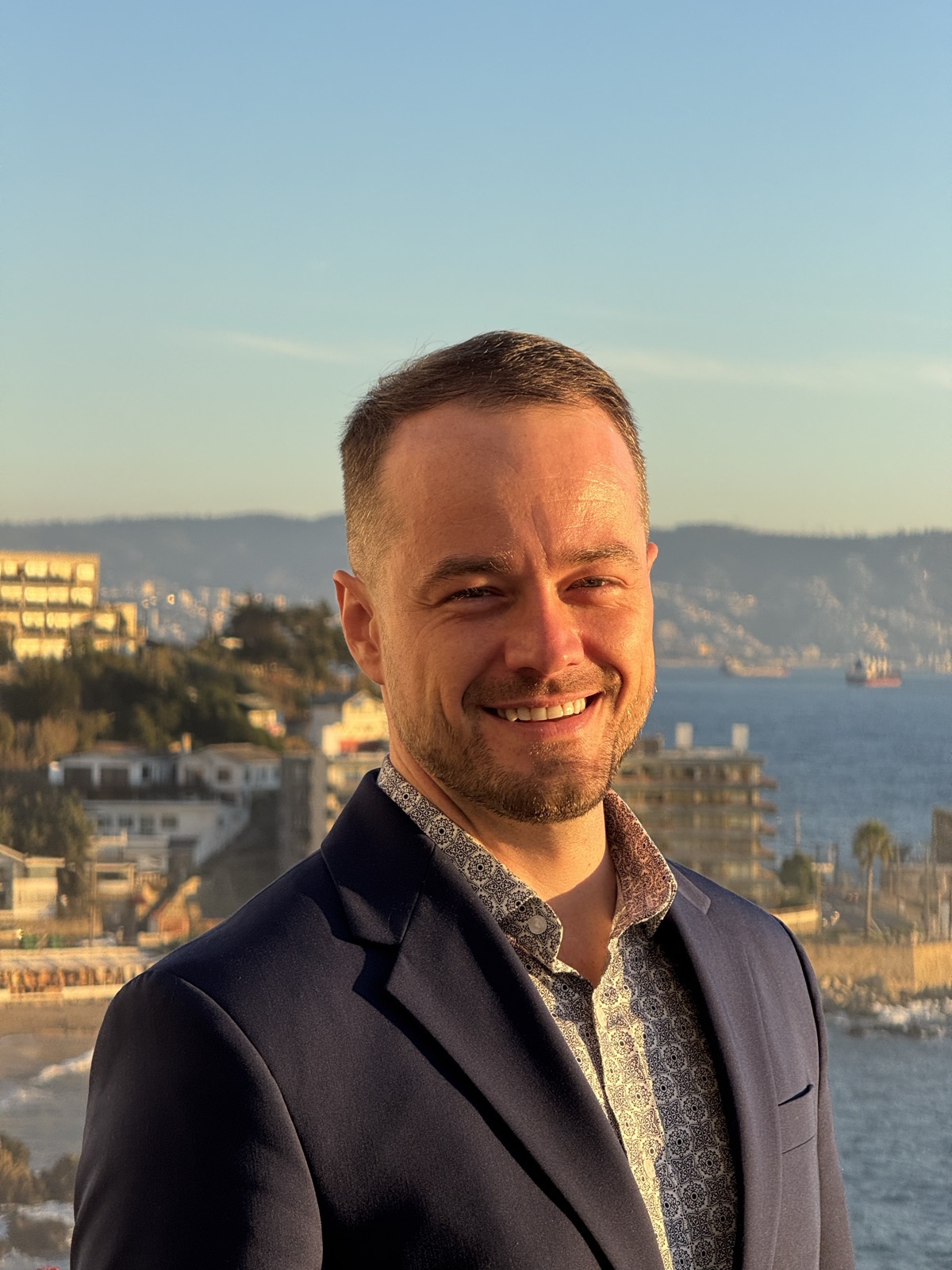 Blake Blackwell smiling on a terrace above the Chilean coast